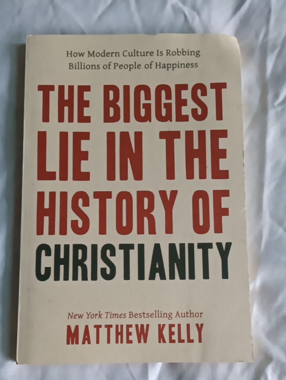 The Biggest Lie in the History of Christianity by Matthew Kelly - Cream & Red